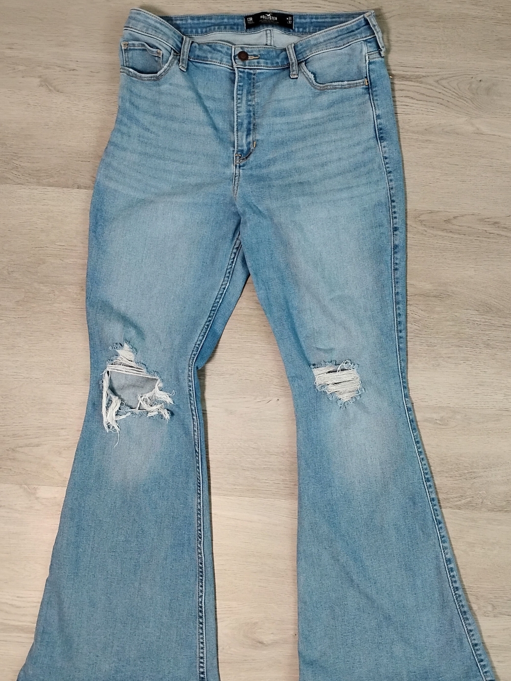 Hollister Light Wash Ripped Flare Jeans.